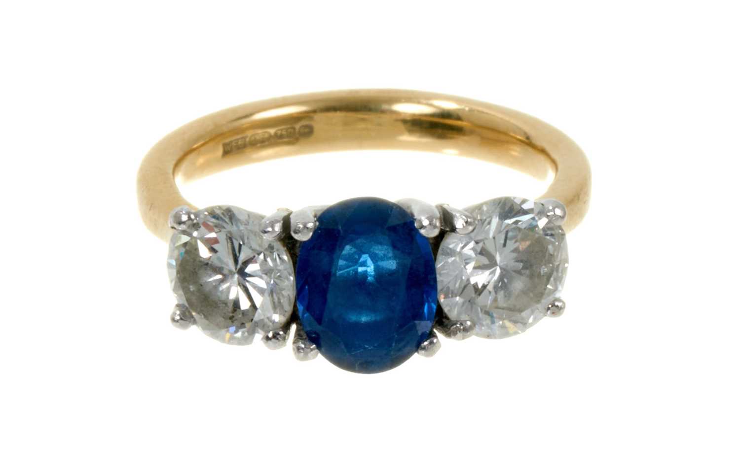 Lot 496 - Diamond and sapphire three stone ring