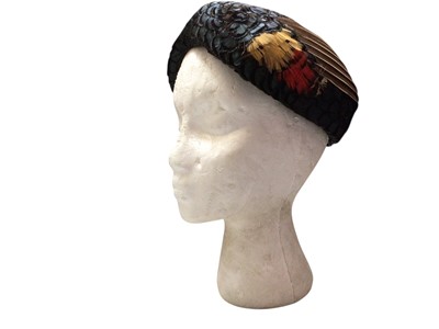 Lot 2075 - 1950's coloured feather hat with a large woven wool shawl.
