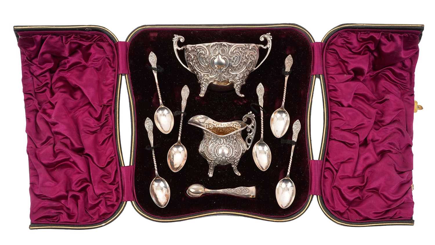 Lot 260 - Late Victorian silver sugar and cream set, with scroll and latticework decoration