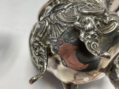 Lot 260 - Late Victorian silver sugar and cream set, with scroll and latticework decoration