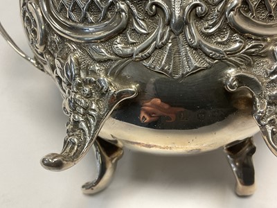 Lot 260 - Late Victorian silver sugar and cream set, with scroll and latticework decoration
