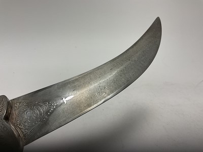 Lot 138 - Good quality 20th century Indian ceremonial dagger with silver inlaid scabbard, grip and elephant head pommel, with curved Damascus steel blade, blade 24cm in length.