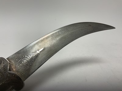 Lot 138 - Good quality 20th century Indian ceremonial dagger with silver inlaid scabbard, grip and elephant head pommel, with curved Damascus steel blade, blade 24cm in length.
