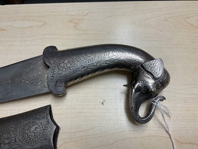Lot 138 - Good quality 20th century Indian ceremonial dagger with silver inlaid scabbard, grip and elephant head pommel, with curved Damascus steel blade, blade 24cm in length.