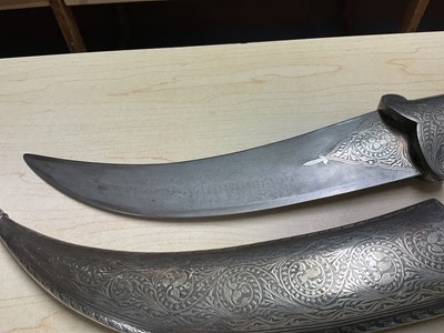 Lot 138 - Good quality 20th century Indian ceremonial dagger with silver inlaid scabbard, grip and elephant head pommel, with curved Damascus steel blade, blade 24cm in length.