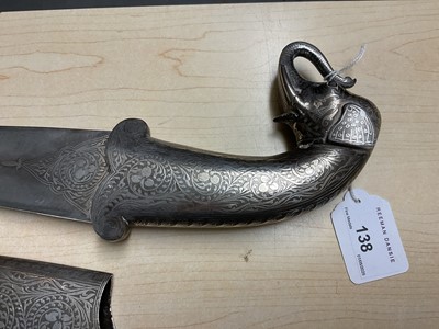 Lot 138 - Good quality 20th century Indian ceremonial dagger with silver inlaid scabbard, grip and elephant head pommel, with curved Damascus steel blade, blade 24cm in length.