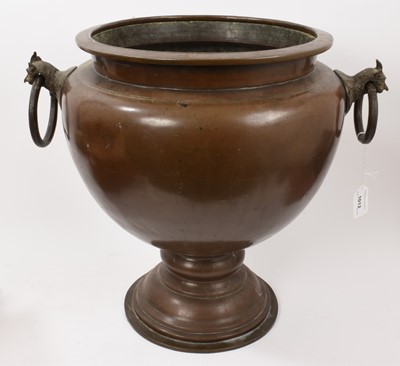 Lot 1012 - Large Eastern brass urn with twin mythical beast ring handles