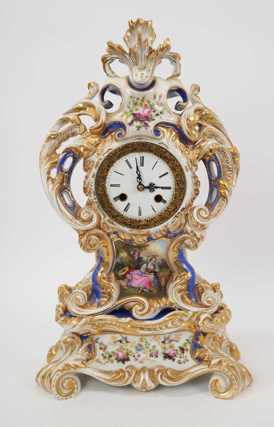 Lot 108 - 19th century French porcelain mantel clock, the case surmounted and applied to the sides with foliate scrolls and painted with ‘fête champetre’ panel, on separate base