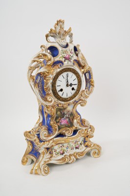Lot 108 - 19th century French porcelain mantel clock, the case surmounted and applied to the sides with foliate scrolls and painted with ‘fête champetre’ panel, on separate base