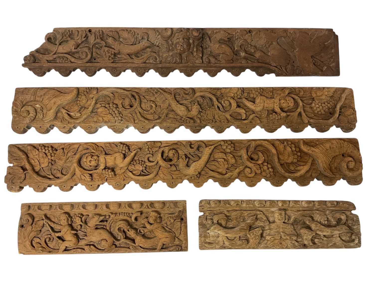 Lot 777 - Three carved oak panels, possibly 16th century, with two smaller panels