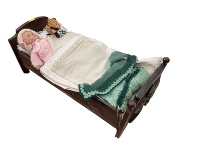Lot 547 - Old carved wooden dolls bed and 2 old dolls.