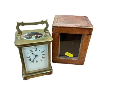 Lot 554 - Early 20th century brass carriage clock in leather travelling case.