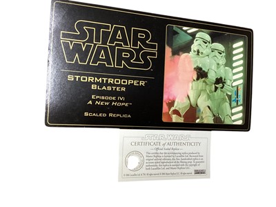Lot 15 - Star Wars Master Replica Episode IV: A New Hope small scaled Stormtrooper Blaster & Episode V:The Empire Strikes Back Han Solo Blaster, both in display cases