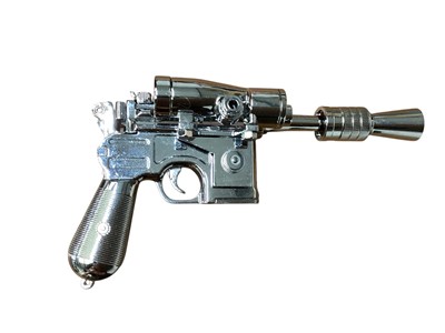 Lot 15 - Star Wars Master Replica Episode IV: A New Hope small scaled Stormtrooper Blaster & Episode V:The Empire Strikes Back Han Solo Blaster, both in display cases