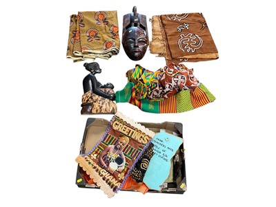 Lot 2462 - Box of African fabrics and works of art