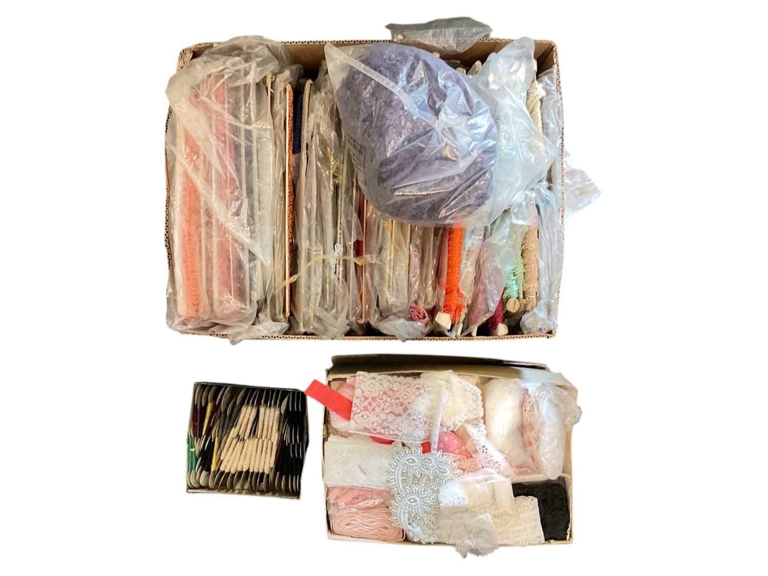 Lot 696 - Group of fabric trims ranging in different patterns and colours, together with a box of thread.
