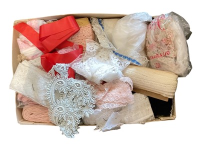 Lot 696 - Group of fabric trims ranging in different patterns and colours, together with a box of thread.