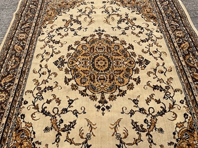 Lot 1347 - Large rug with central medallion on cream and brown ground, 280cm x 203cm
