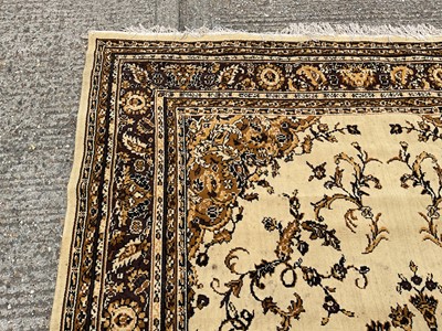 Lot 1347 - Large rug with central medallion on cream and brown ground, 280cm x 203cm