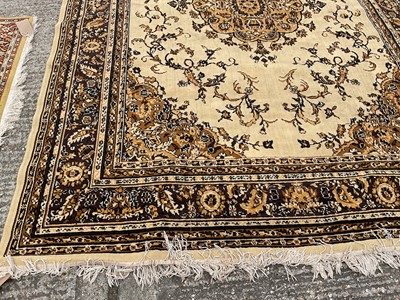 Lot 1347 - Large rug with central medallion on cream and brown ground, 280cm x 203cm