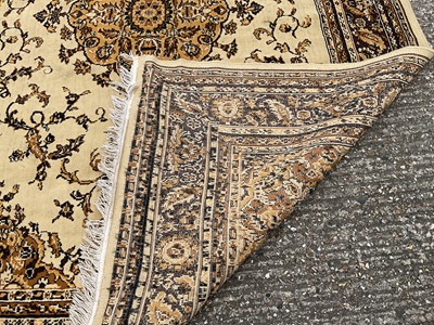 Lot 1347 - Large rug with central medallion on cream and brown ground, 280cm x 203cm
