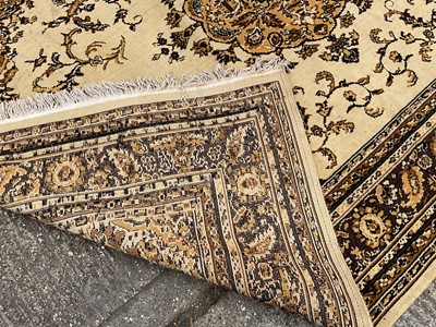 Lot 1347 - Large rug with central medallion on cream and brown ground, 280cm x 203cm