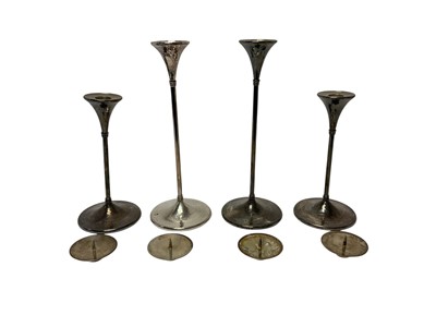Lot 292 - Set of four Arts & Crafts silver candlesticks