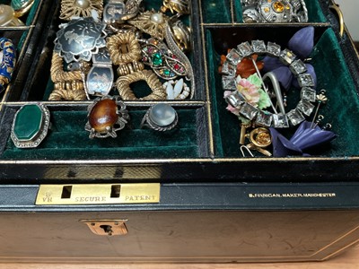 Lot 35 - Victorian leather jewellery box containing vintage costume jewellery and bijouterie including a 1970s silver bangle
