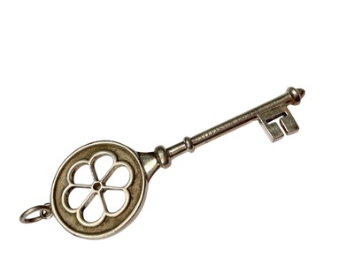 Lot 10 - Tiffany & Co silver daisy diamond set key pendant in pouch