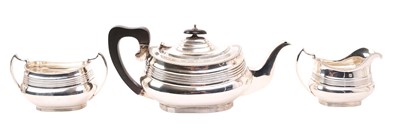 Lot 498 - 1920s silver three piece tea set, comprising tea pot of ribbed form, with gadrooned border