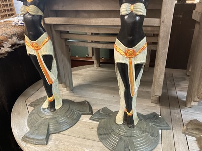 Lot 918 - Pair of Art Deco style cast iron table pedestals, with Egyptian figural supports on stepped spread base, 71cm high