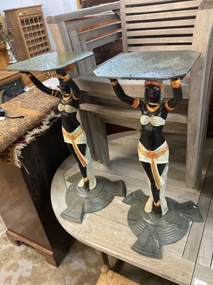 Lot 918 - Pair of Art Deco style cast iron table pedestals, with Egyptian figural supports on stepped spread base, 71cm high