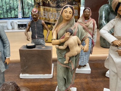 Lot 834 - Group of twelve Indian Company School terracotta figures, depicting various trades