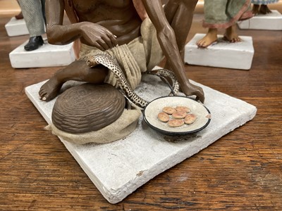 Lot 834 - Group of twelve Indian Company School terracotta figures, depicting various trades