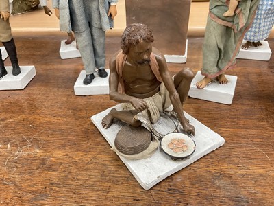 Lot 834 - Group of twelve Indian Company School terracotta figures, depicting various trades