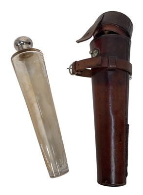 Lot 942 - Vintage leather cased glass saddle flask with silver plated mount, 27cm long overall