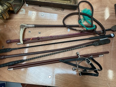 Lot 68 - Swaine & Adeney silver mounted hunting whip with horn handle and leather shaft, together with various other whips and a pair of spurs
