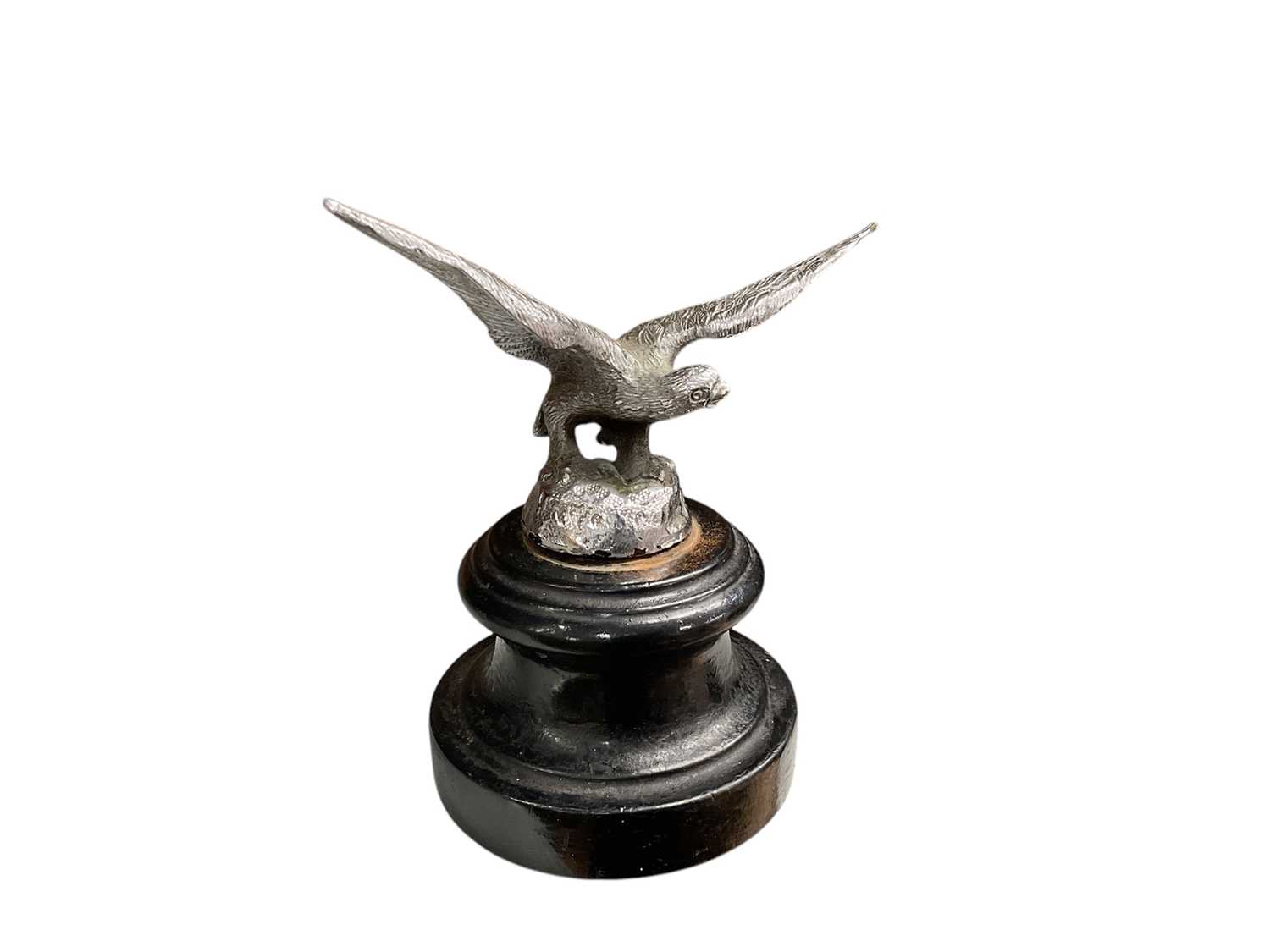 Lot 1 - Vintage chromium plated car mascot in the form of a bird of prey, mounted on an ebonised turned wood base, 14cm in height (including base).