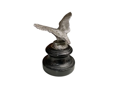 Lot 1 - Vintage chromium plated car mascot in the form of a bird of prey, mounted on an ebonised turned wood base, 14cm in height (including base).
