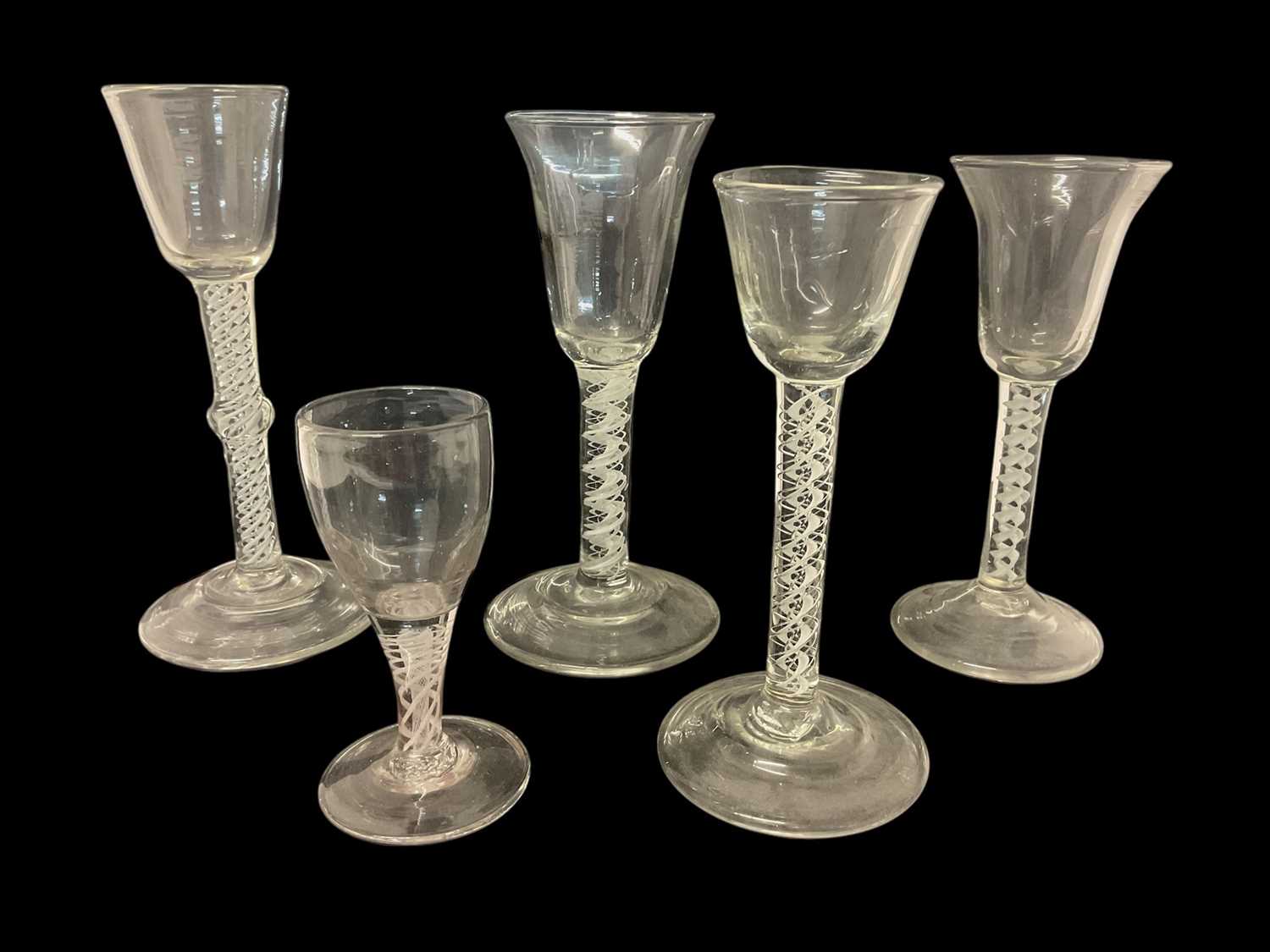 Lot 37 - Five 18th/19th century continental opaque twist wine glasses, 11cm to 18.75cm high