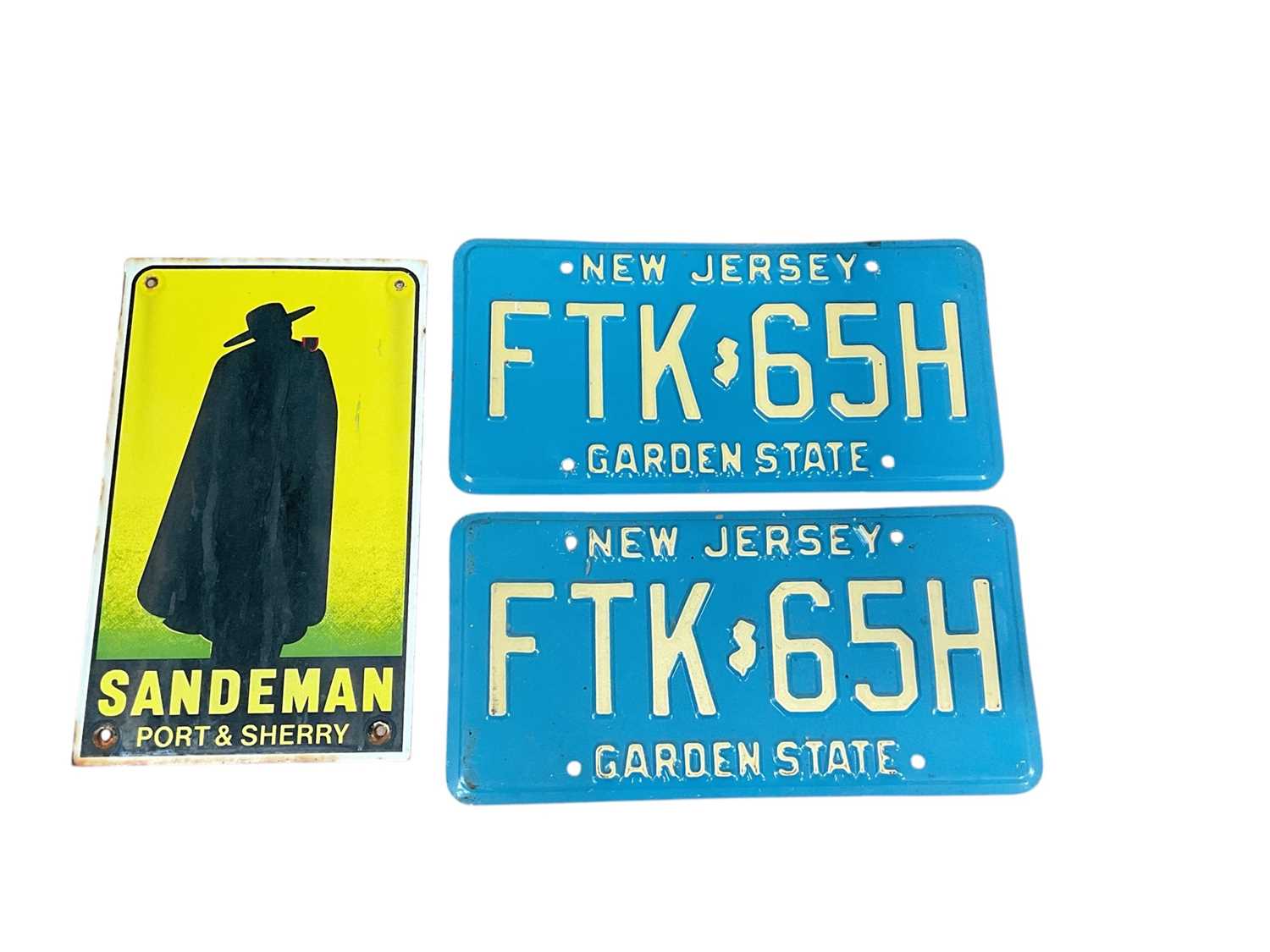 Lot 12 - Reproduction Sademan Port & Sherry enamel sign together with a pair of New Jersey American licence plates (3).