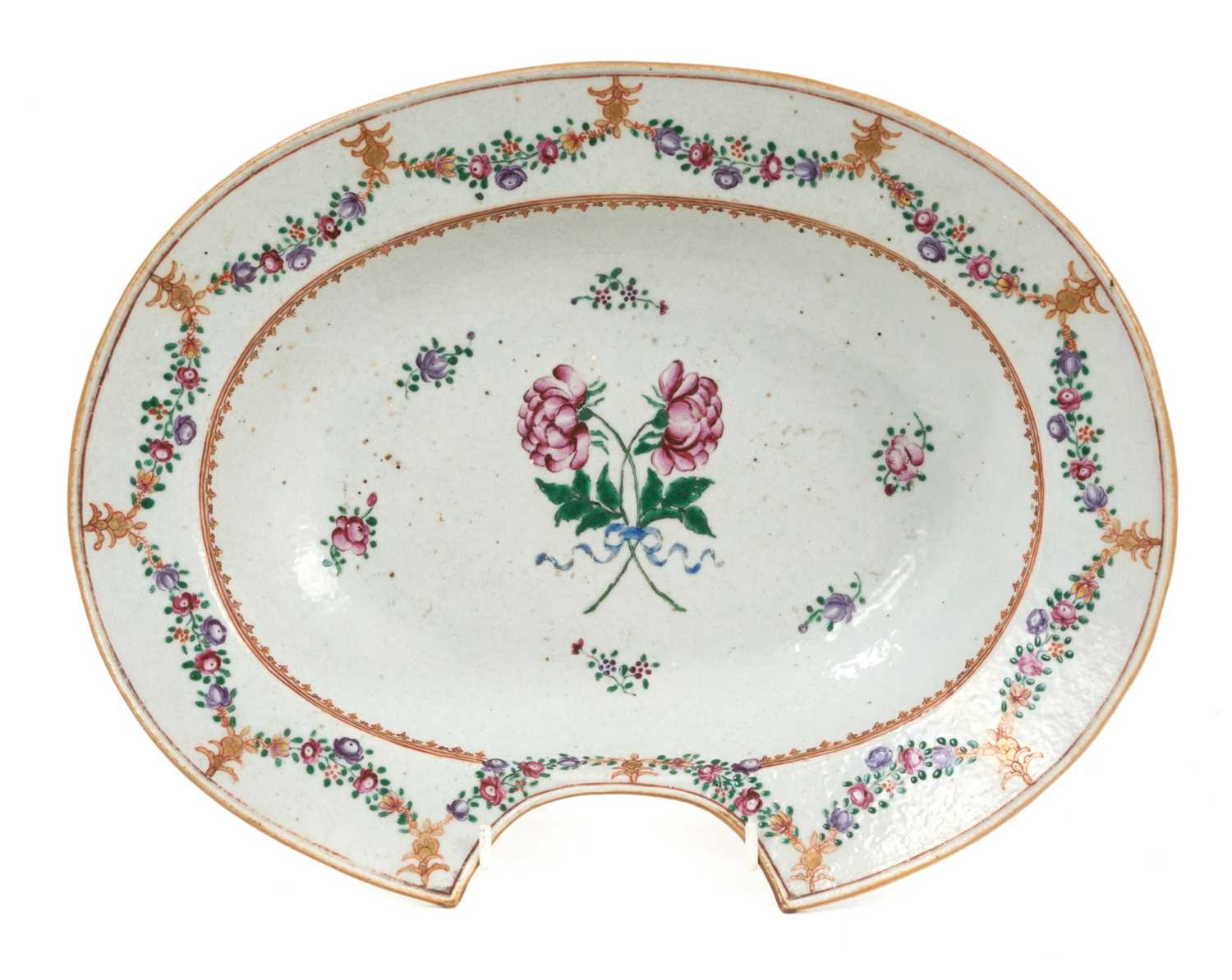 Lot 33 - 18th century Chinese famille rose export porcelain barber's bowl, painted with floral sprays and swags, 31cm wide