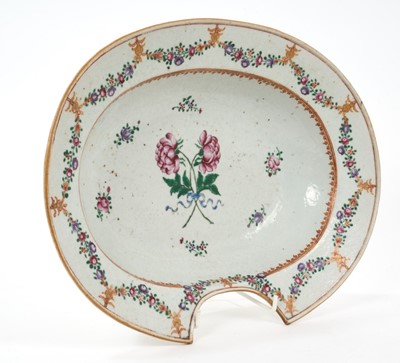 Lot 33 - 18th century Chinese famille rose export porcelain barber's bowl, painted with floral sprays and swags, 31cm wide