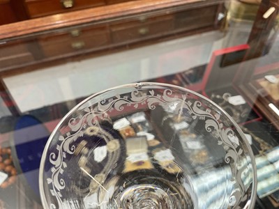 Lot 22 - Pair of light baluster wine glasses, circa 1730, with tapering funnel bowls, knopped and cushioned baluster stems with tear-drop, on a conical foot, the rim engraved with a band of scrolling f...