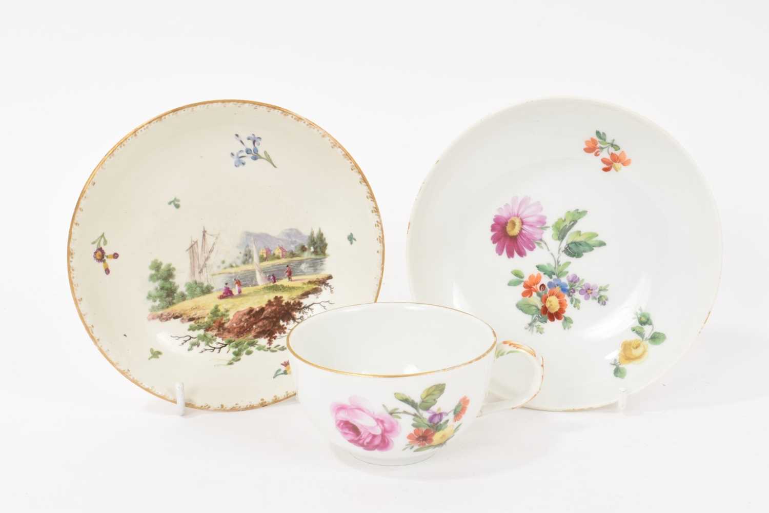 Lot 128 - Late 18th/early 19th century Berlin porcelain cup and saucer, painted with flowers, and a Frankenthal saucer (3)