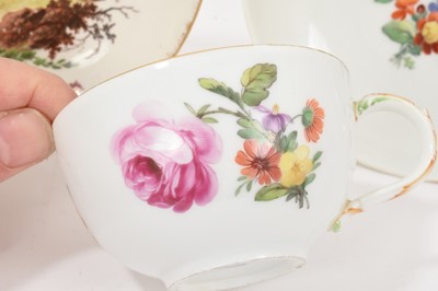 Lot 128 - Late 18th/early 19th century Berlin porcelain cup and saucer, painted with flowers, and a Frankenthal saucer (3)