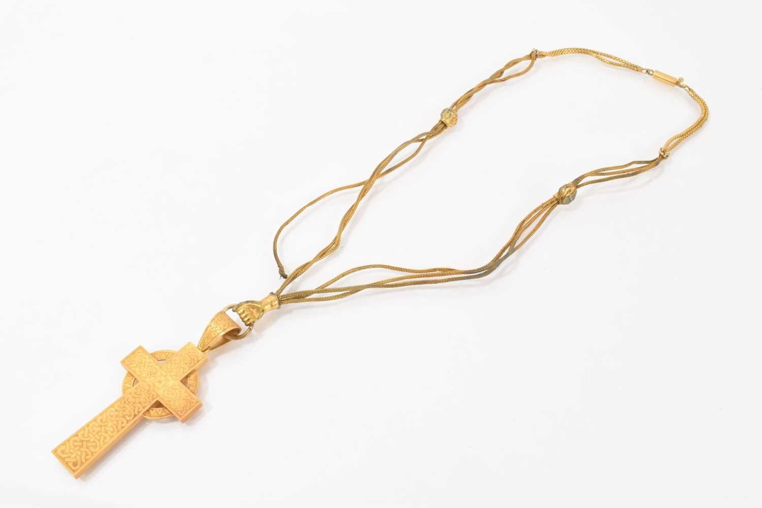Lot 464 - Victorian yellow metal Celtic cross pendant on a gilt metal three strand chain