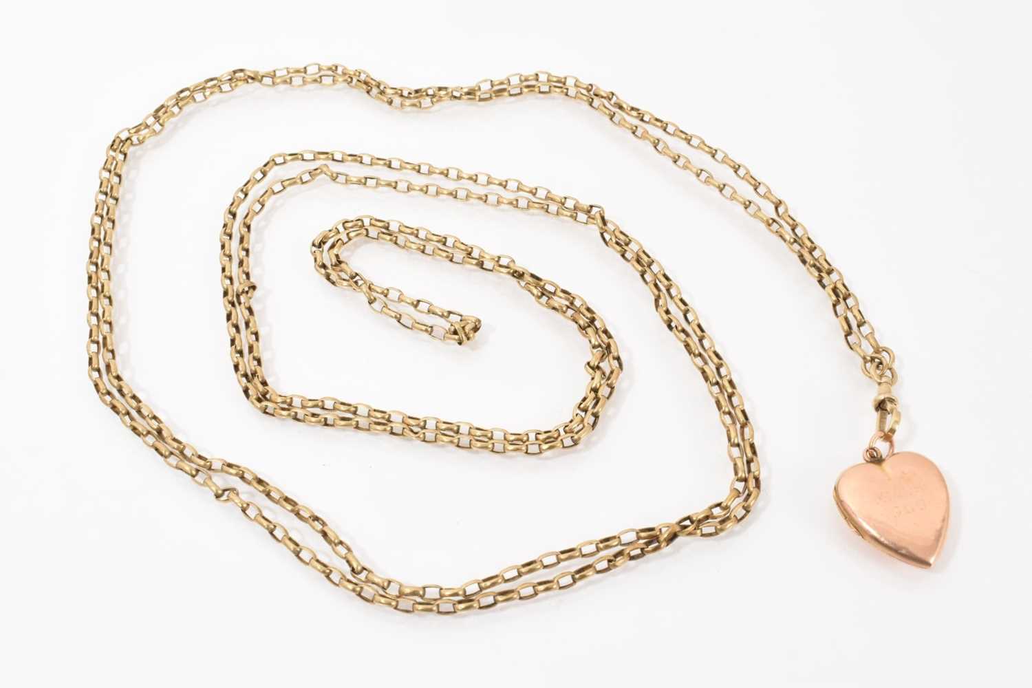 Lot 467 - Victorian yellow metal guard chain with gold heart shaped locket engraved 'Xmas 1909'