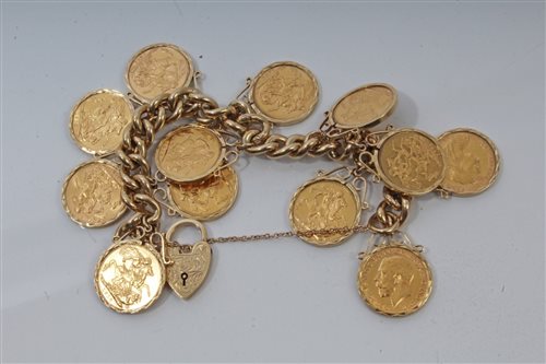 Lot 34 - G.B. gold Sovereigns suspended by ring mounts...