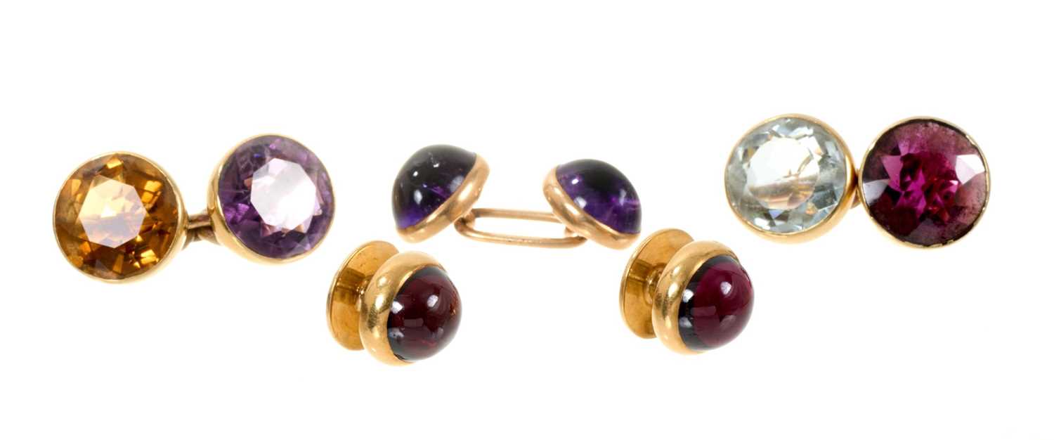 Lot 470 - Pair of gold multi-gem round faceted stone cufflinks, one 15ct gold amethyst cabochon cufflink and pair of continental gold cabochon garnet dress studs